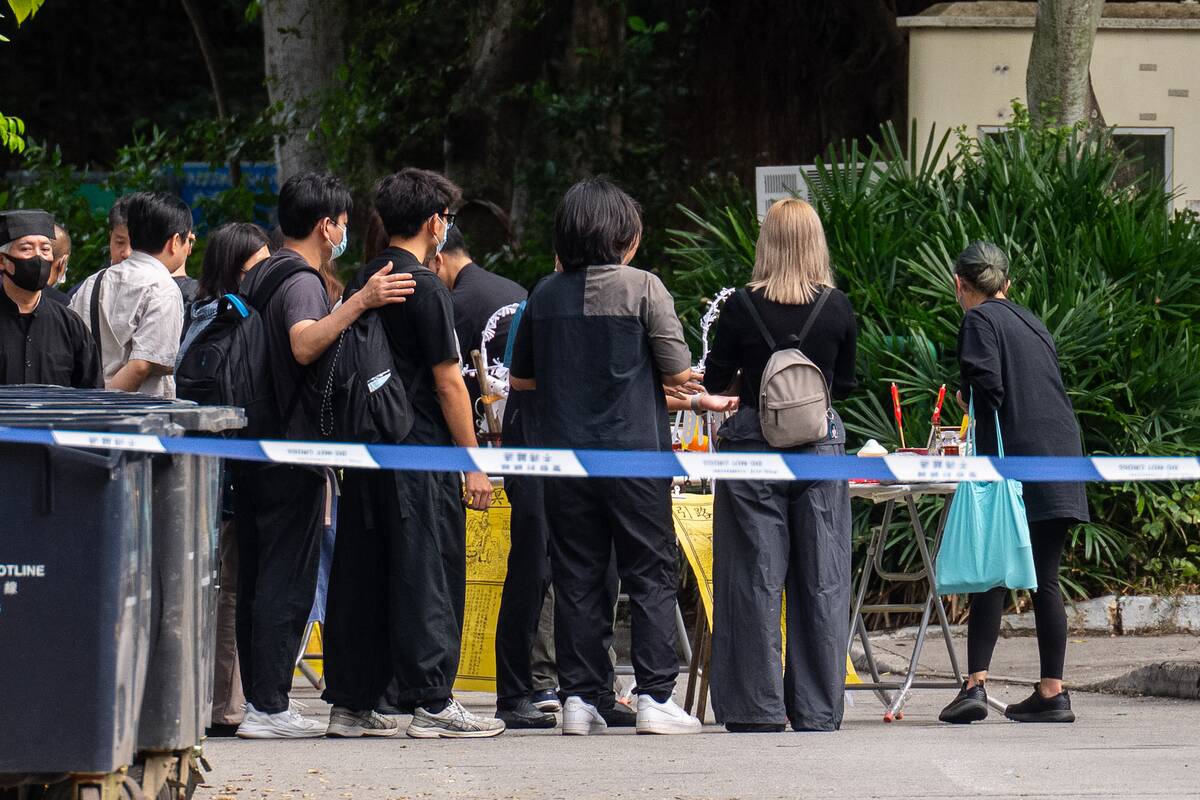 Honkongo policija dėl praėjusią savaitę kilusio gaisro sulaikė tryliką žmonių