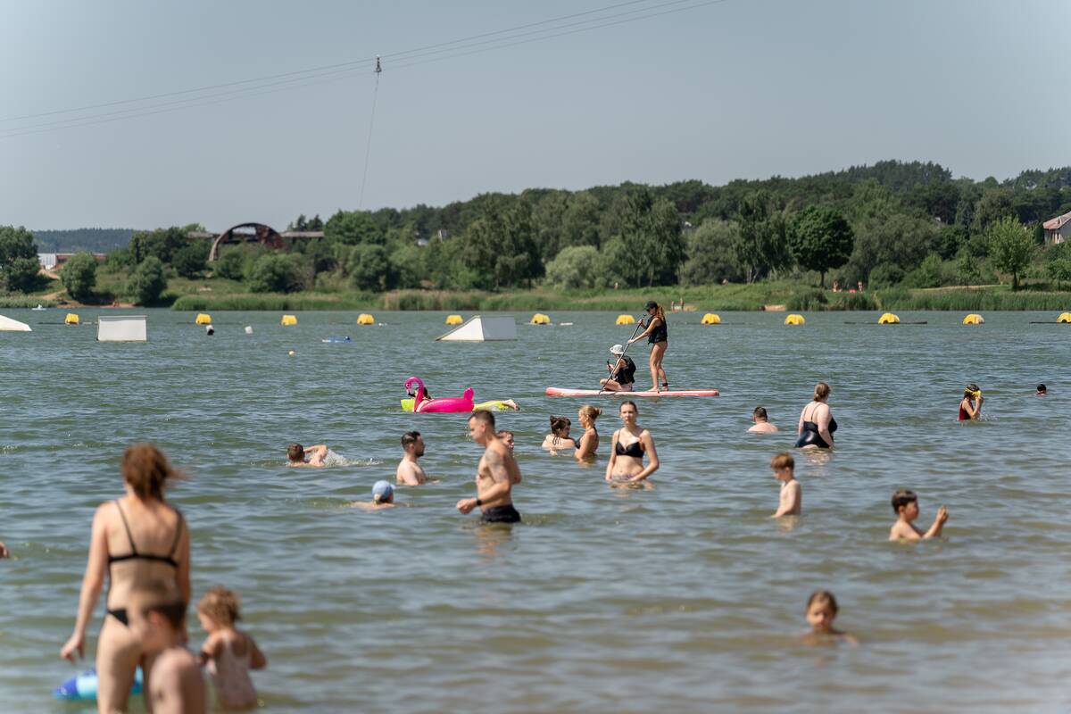 Karštis ištuštino gatves, bet užpildė Kauno paplūdimius
