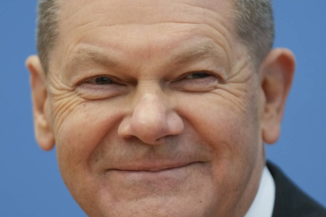 Olafas Scholzas ir Angela Merkel