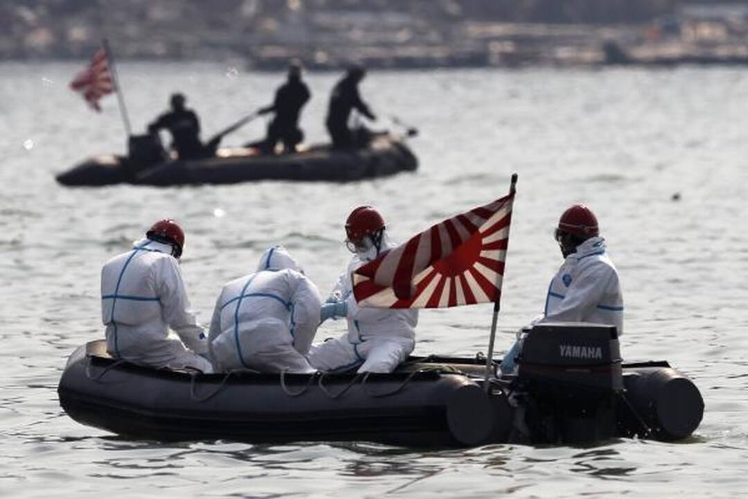 Japonijos policija pradėjo žuvusiųjų paieškas netoli cunamio nuniokotos AE