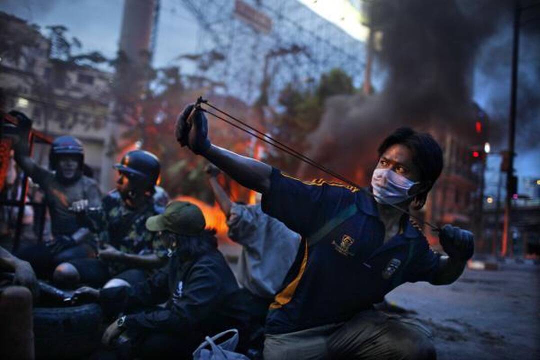"World Press Photo" konkursą laimėjo nuo vyro smurto nukentėjusią afganę vaizduojanti nuotrauka