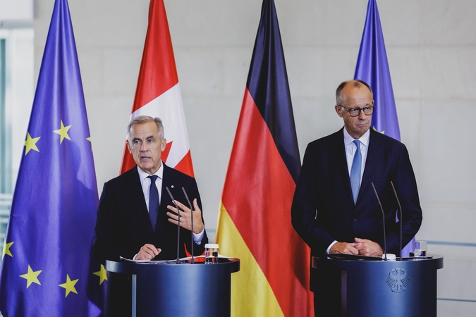 Markas Carney'is (kairėje) ir Friedrichas Merzas