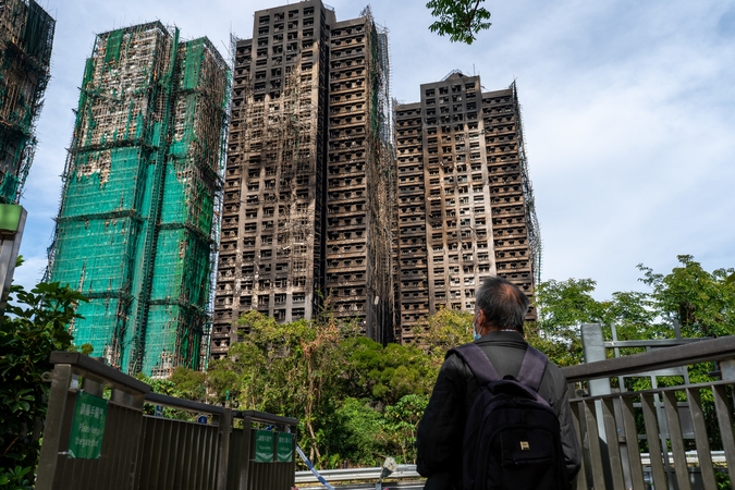 Honkonge dėl mirtino gaisro sulaikyti aštuoni asmenis