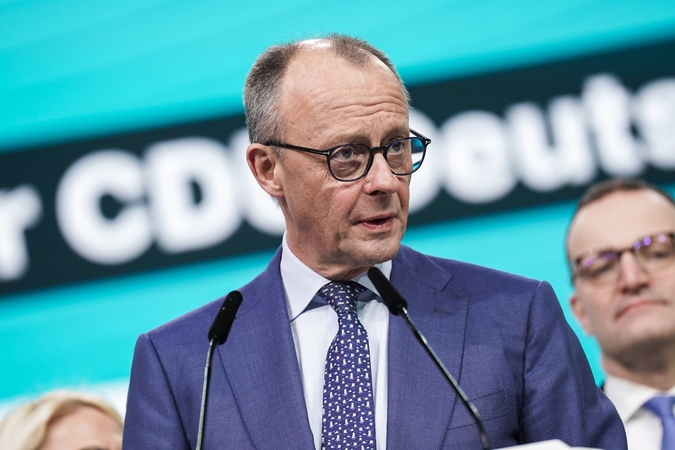 Vokietijos kancleris prieš kelionę į JAV teigia siekiantis aiškios Europos pozicijos dėl muitų 