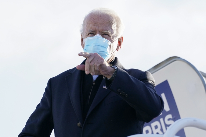 J. Bidenas ragina rinkėjus išgelbėti JAV „sielą“