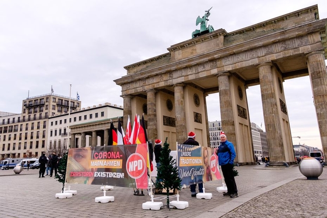 Vokietijoje – mirčių nuo COVID-19 rekordas, A. Merkel reikalauja griežtesnių priemonių