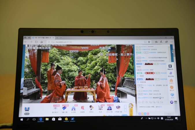 Specialieji efektai ir virtualūs svečiai: Kinijos vestuvės persikėlė į internetą