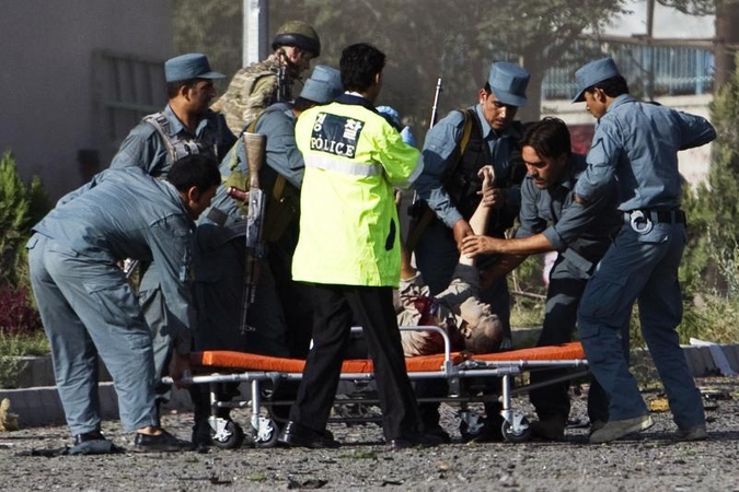 Afganai protestuoja prieš kruviną JAV kario išpuolį