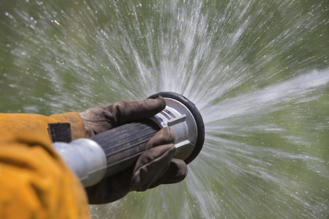 Suimti įtariamieji, galėję padegti policijos automobilius (papildyta)